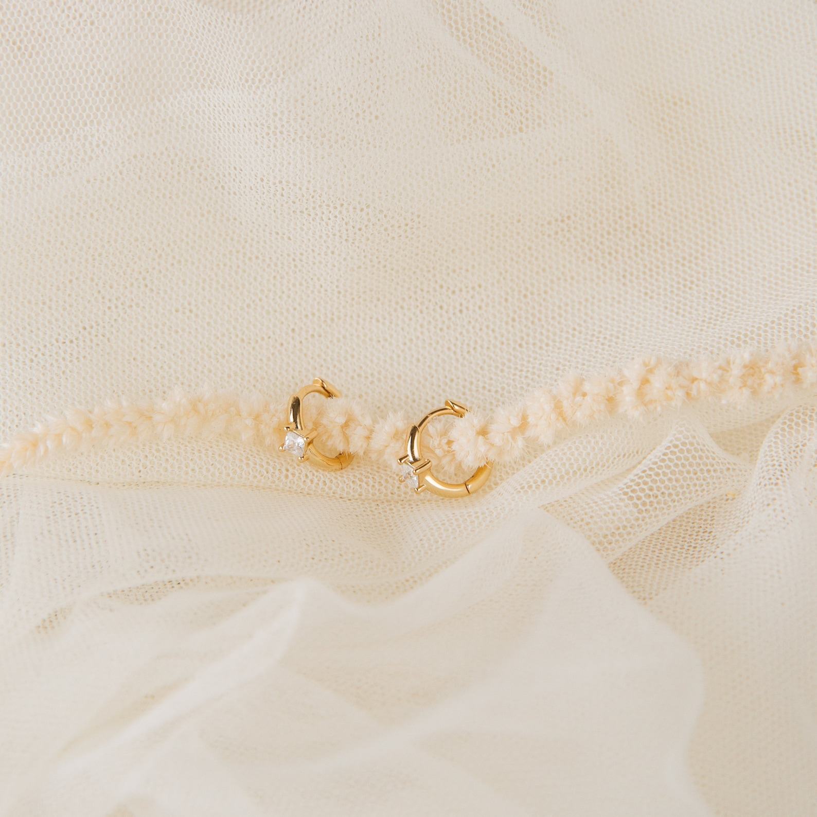 Sparkling Embrace Caitlyn’s Minimalist Diamond Huggie Earrings