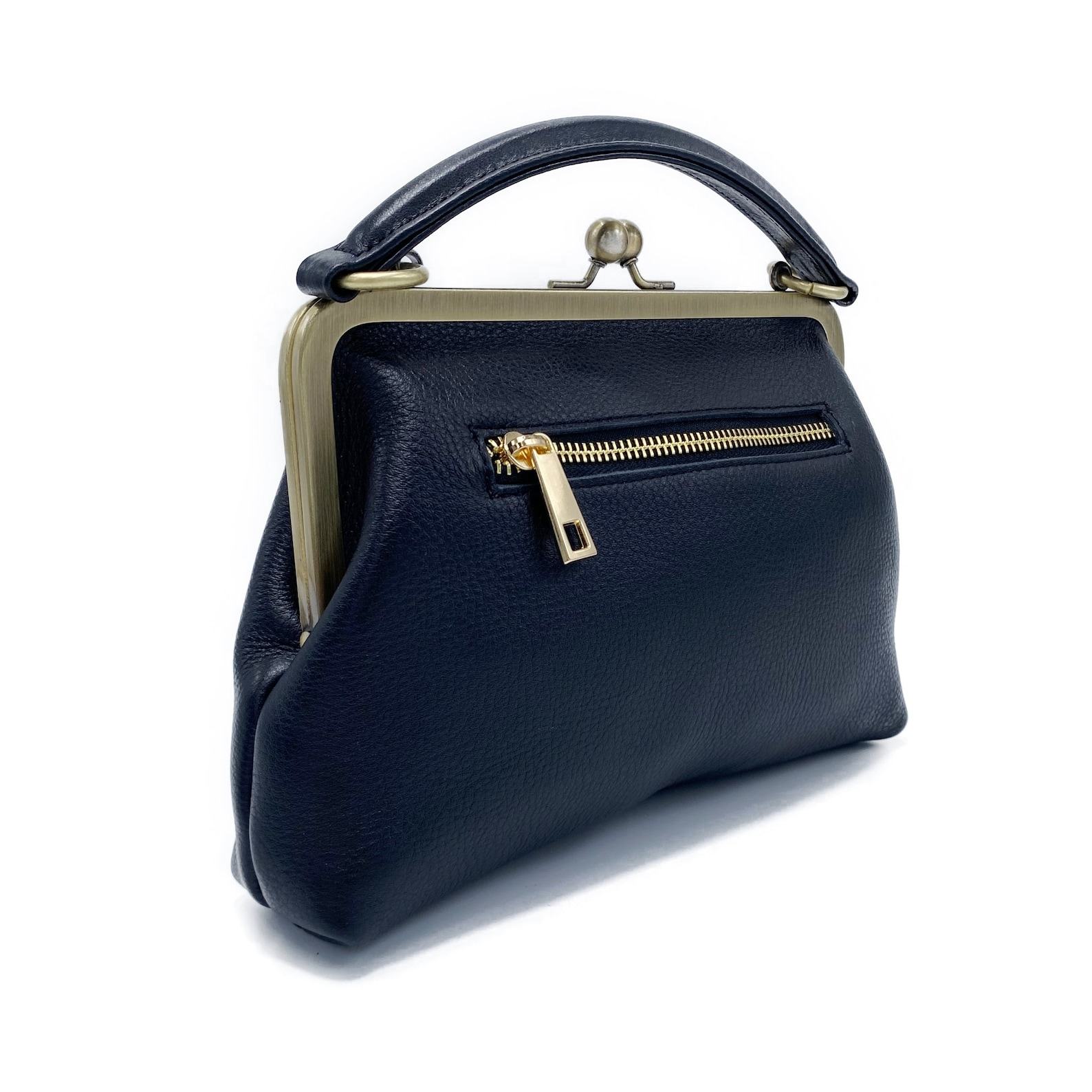 Timeless Elegance Black Leather Handbag with Kiss Lock Charm