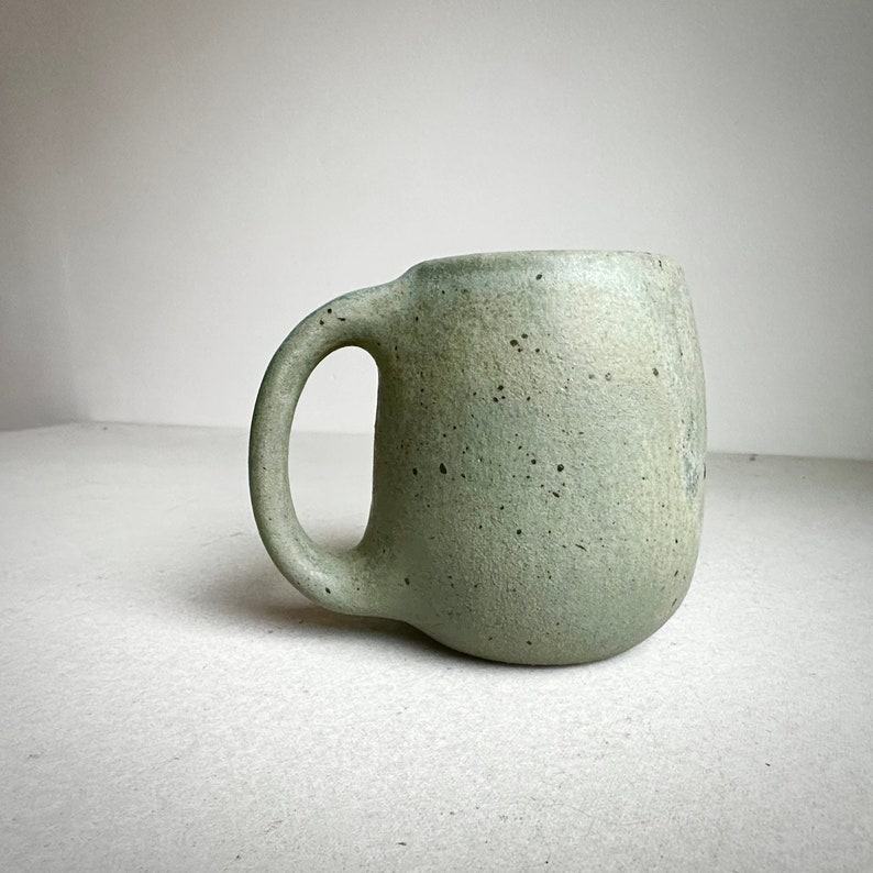 Timeless Treasures Handcrafted Aged Green Ceramic Mug for Your Daily Ritual