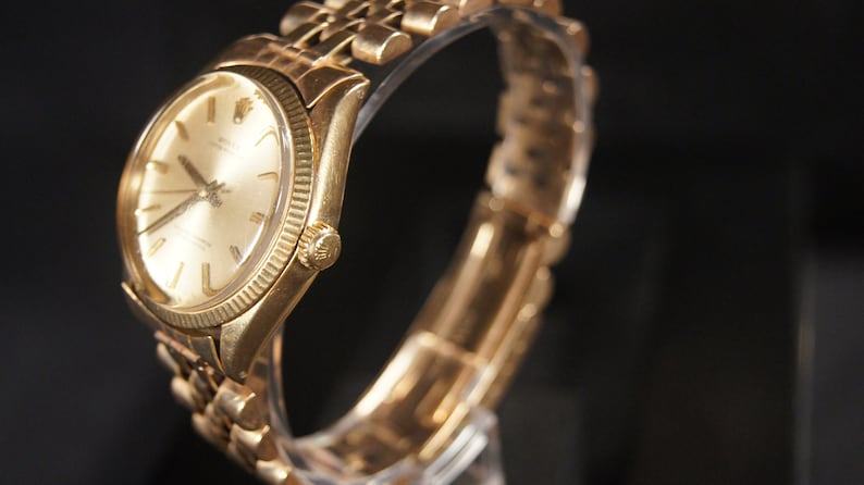 Vintage Rolex Oyster Perpetual A Timeless Treasure in 14K Gold (Circa 1965)