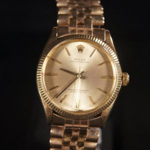 Vintage Rolex Oyster Perpetual A Timeless Treasure in 14K Gold (Circa 1965)