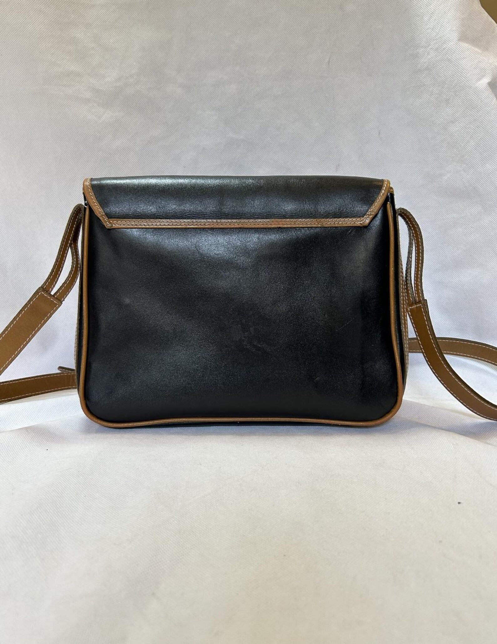 Yves Saint Laurent Black and Brown Leather Crossbody Bag A Timeless Accessory for the Modern Woman - Image 4