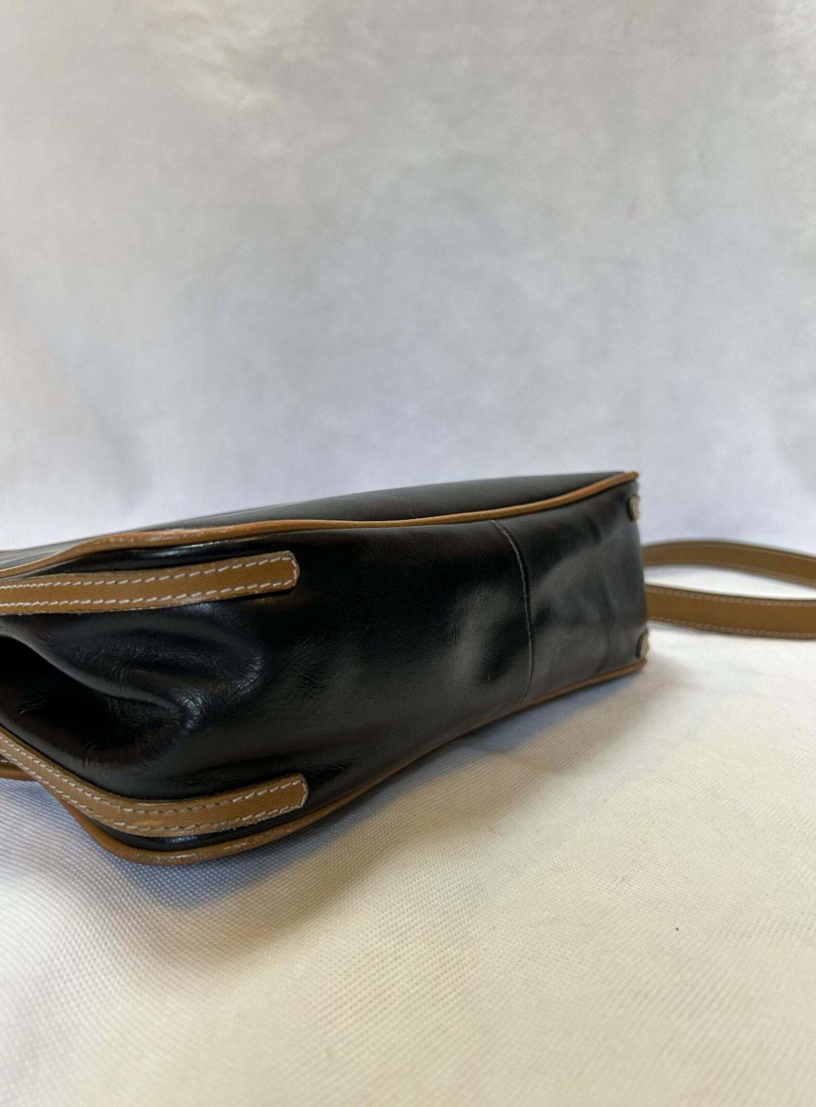 Yves Saint Laurent Black and Brown Leather Crossbody Bag A Timeless Accessory for the Modern Woman - Image 5