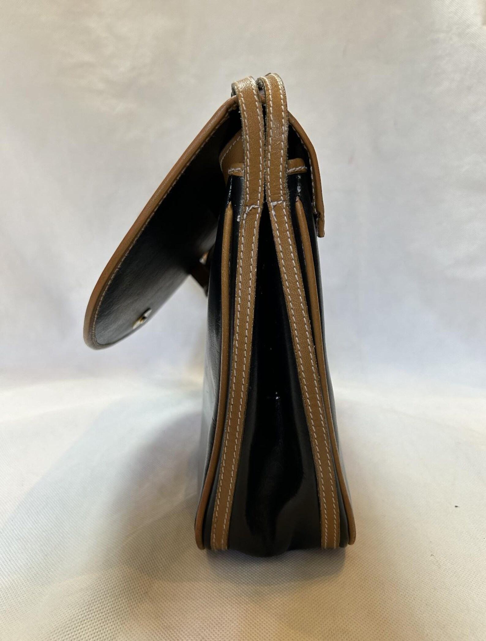 Yves Saint Laurent Black and Brown Leather Crossbody Bag A Timeless Accessory for the Modern Woman - Image 6